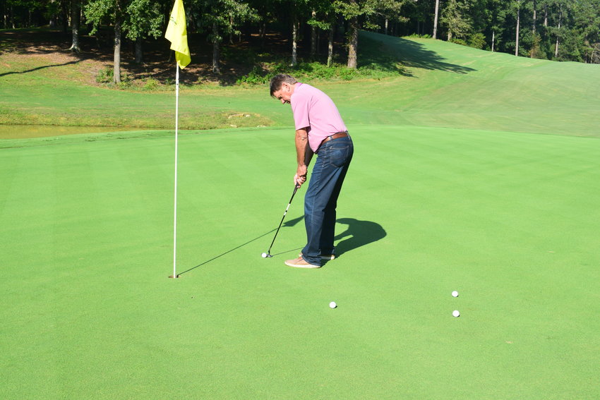 Stan Webb practices his putting in advance of the annual Fore-A-Cure golf tournament scheduled for Sept. 30.